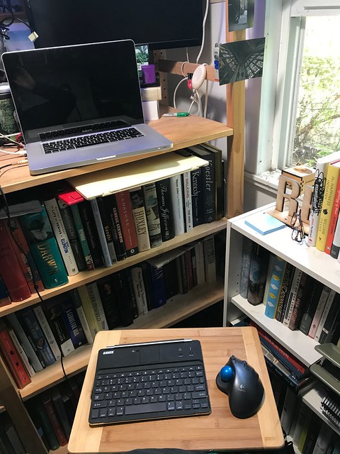New lap desk: a bamboo cutting board from the kitchen.